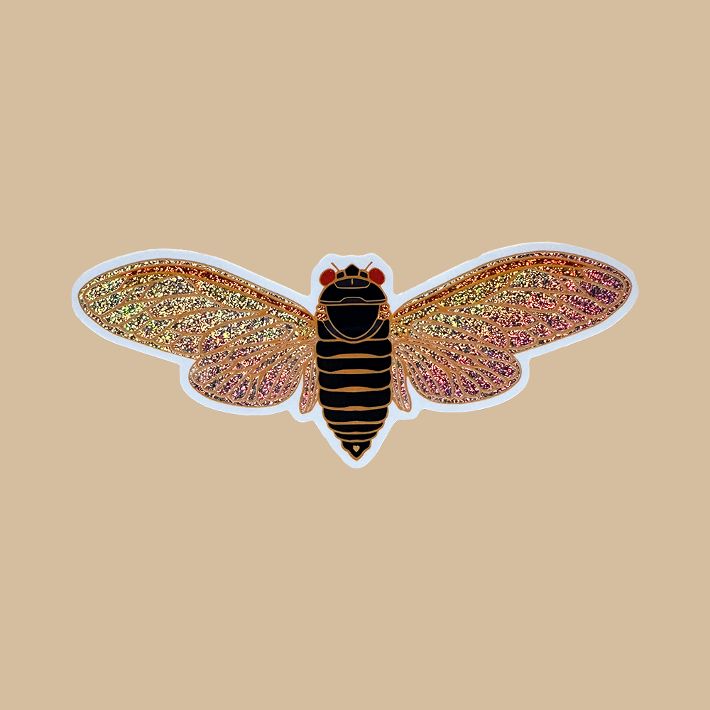 Insect-shaped object with glittery wings on a beige background