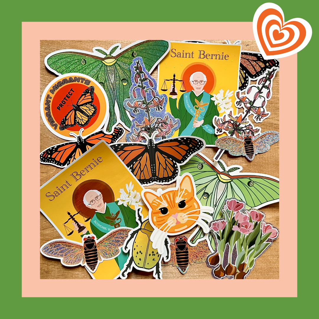 Collection of stickers featuring animals, nature, and a character named Saint Bernie on a wooden surface.